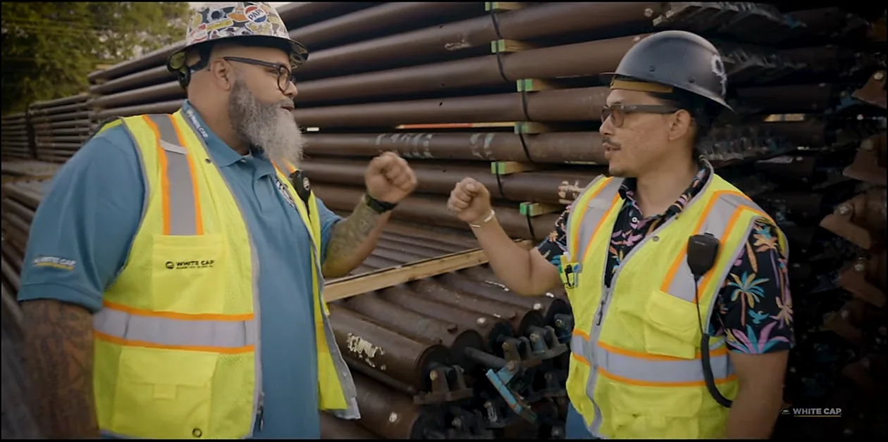 Branded workwear produced by Adequate Apparel being worn on the job