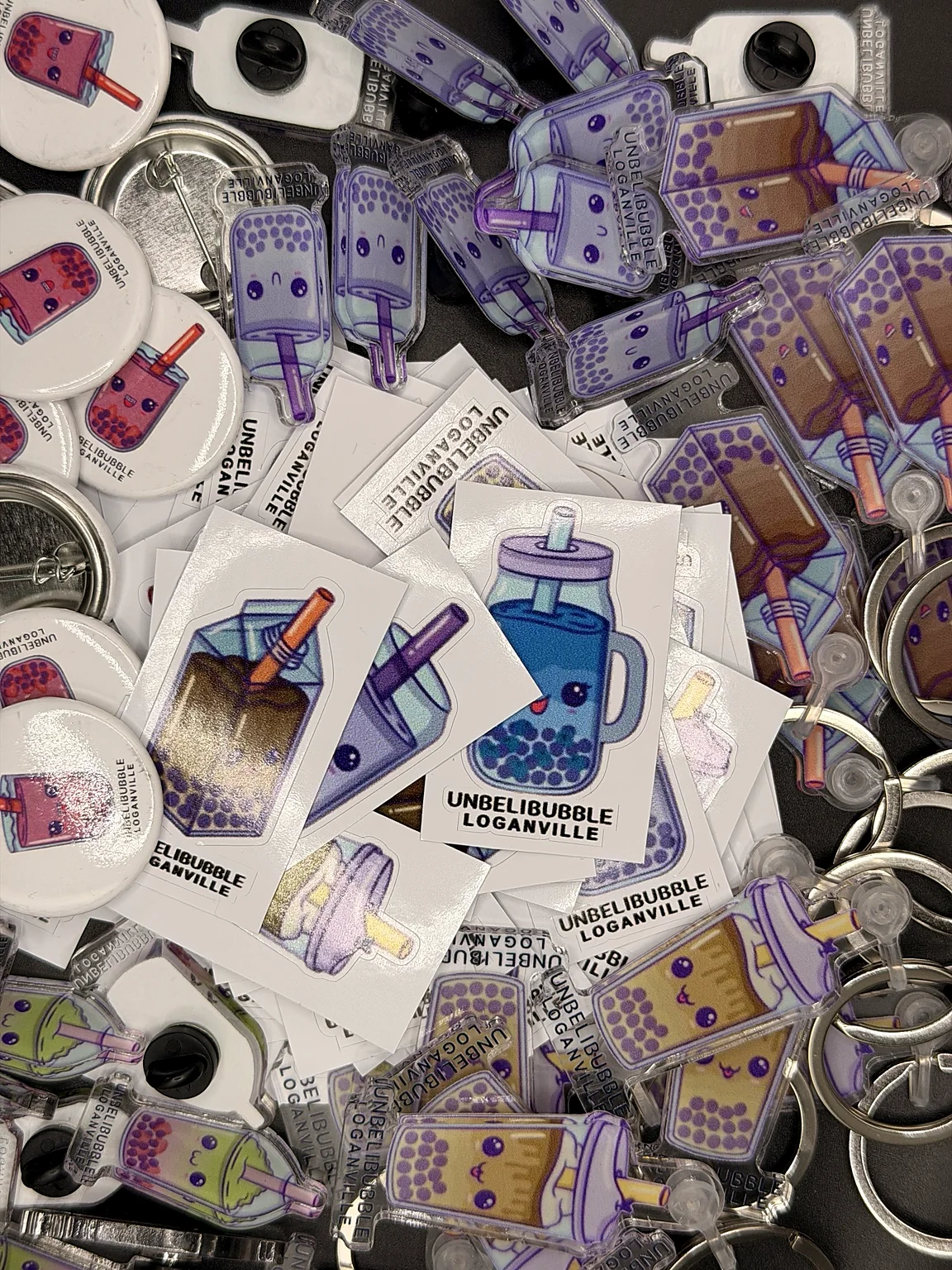 Bubble tea stickers, buttons, and keychains branded for Unbelibubble Loganville